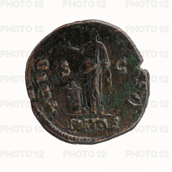 Dupondius/as, Hadrian 76–138; Roman emperor 117–138 issuer, Antoninus Pius 86–161; Roman emperor 138–161 caesar 138. Obverse: Head of Antoninus Pius bare to right, legend IMP TAELIVS CAE - SAR ANTONINVS. Reverse: Pietas stands left before an altar, making an offering with his right hand and holding a container with perfumes in his left; legend TRIB POT COS DES II, scene labeled PIETAS. 138 CE, Roman Empire, Rome. Coin; diameter 25.5–26.0 mm, weight 14.16 g, axis 165°., A round, worn metal coin with a dark brown surface and patches of green corrosion shows the faint raised outline of a robed standing figure facing forward with an outstretched arm and a smaller pedestal or object beside them; the coin edge is irregular with a small notch and a dotted border along part of the rim, and the relief details include several raised, weathered shapes around the figure and faint traces of lettering that are not described.