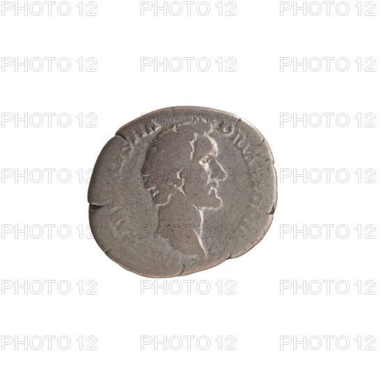 Denarius of Antoninus Pius 86–161; Roman emperor 138–161. Obverse: Head of Antoninus Pius uncovered to the right with legend IMP TAEL CAES HA - DRI ANTONINVS. Reverse: Aequitas standing to the left, holding scales in his outstretched right hand and a cornucopia in his left, with legend AVG PIVS PM T - RP COS DES II. Date: 138. Place: Rome, Roman Empire. Coin; diameter 15.0–19.5 mm, weight 2.80 g, axis 165 degrees., A worn circular coin with a raised profile of a person's head in relief, shown in right-facing profile; the coin surface appears aged and uneven with small chips and cracks along the edge and a patina of gray and brown tones, with lighter highlights on the raised areas.