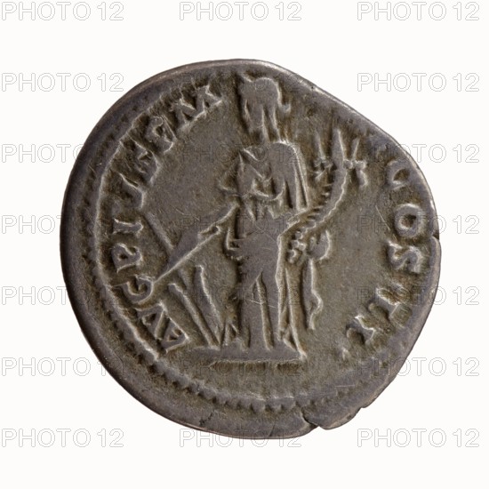 Denarius of Antoninus Pius 86–161; Roman emperor 138–161. Obverse: bare head of Antoninus Pius right, legend IMP T AEL CAES HADR - ANTONINVS. Reverse: Fortuna standing left, holding a rudder in her right hand and a cornucopia in her left, legend AVG PIVS PM - TR P COS II. Date: 139. Rome, Roman Empire. Bronze/silver coin; diameter ~17.5–18.0 mm, weight 3.52 g, axis 180°., A circular metallic coin with a worn, uneven edge and a greyish-brown patina shows a raised relief of a standing human figure in profile, draped in a long garment and holding a long staff or spear; the figure faces left and has details of hair or a headpiece and what appears to be drapery folds and a curved object beside the body. The coin surface includes a dotted border around the rim and several raised areas of texture and wear; visible colors are grey, brown, and hints of darker grey.