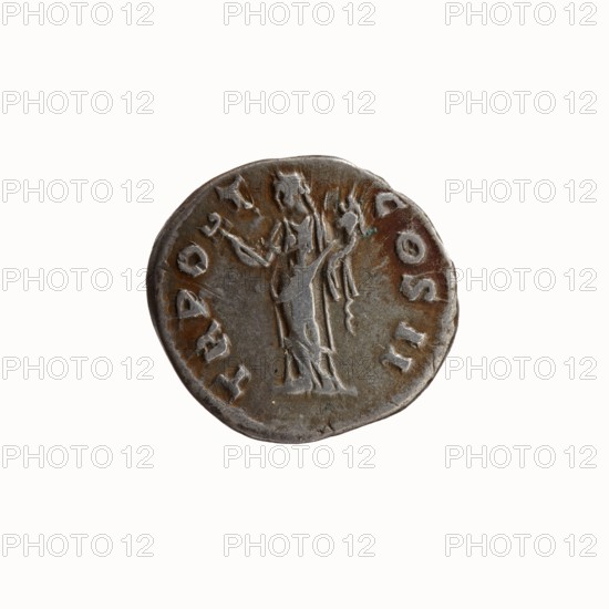 Denarius, Antoninus Pius 86–161; Roman emperor 138–161, struck 139. Obverse: Head of Antoninus Pius uncovered to the right, legend ANTONINVS AVG PIVS PP. Reverse: Felicitas standing to left, holding a caduceus in her outstretched right hand and a cornucopia in her left, legend TR P O T COS II. Iconography: caduceuses, personifications, Felicitas with caduceus and cornucopia. Roman Empire; Rome. Coin; diameter 17.0–18.0 mm; weight 2.86 g; axis 180°., A round metal coin with a worn surface showing a raised figure in the center wearing a long draped garment and holding objects in both hands, surrounded by raised marks along the rim; the coin has a patina with brown and gray tones and small areas of darker discoloration, and the background is plain white.
