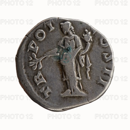 Denarius of Antoninus Pius 86–161; Roman Emperor 138–161. Obverse: Head of Antoninus Pius uncovered to the right; inscription ANTONINVS · AVG · PIVS · PP. Reverse: Pax standing left, holding a twig in his right hand and a cornucopia horn of plenty in his left; inscription TR · POT · COS II. Iconography: Pax, personification, twigs, cornucopia. Roman Empire, Rome, 139. Coin denarius; diameter 17.0–18.0 mm, weight 3.27 g, axis 180°., A round metallic coin with a worn surface showing a raised figure of a standing person in profile, draped in a long garment and holding a branchlike object in one hand and a small round object in the other; the coin's rim is uneven with several small chips and indentations, and there are faint raised markings around the edge that form a circular border; the metal appears mostly gray with darker gray shadows and a few small greenish-blue oxidation spots on the figure.