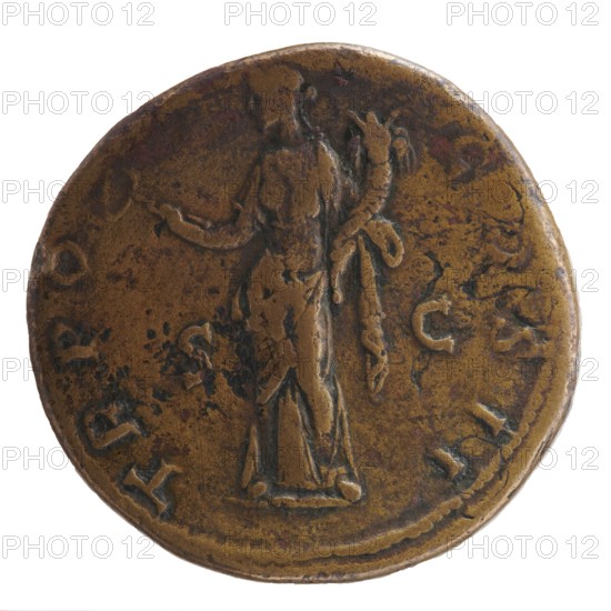 Sestertius, Antoninus Pius 86–161; Roman emperor 138–161. Obverse: head of Antoninus Pius in a laurel wreath facing right; legend ANTONINVS·AVG·PIVS·PP. Reverse: Felicitas standing frontally, head facing left, holding a caduceus in her outstretched right hand and a horn of plenty in her left; legend T·RPO·T·COSII, in SC; fields: 139. Roman Empire, Rome. Coin; diameter 32.0–32.5 mm; weight 23.96 g; axis 180°., A round metal object with a worn, uneven surface showing brown and dark brown tones, featuring a faint raised figure of a person standing in the center with an outstretched arm and draped clothing, surrounded by a ring of raised markings and decorative irregularities around the edge.