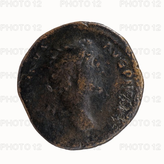 Dupondius of Antoninus Pius 86–161; Roman Emperor 138–161. Obverse: Head of Antoninus Pius in a radiant crown facing right, legend ANTONINVS - AVG PIVS PP. Reverse: Pax standing left, holding a branch in his right hand and a cornucopia in his left, legend TR - POT COS II, in SC. Struck Rome, 139 CE, Roman Empire. Bronze coin dupondius, diameter ~26–27 mm, weight 12.67 g, axis 180°. Icons: Pax, branches, cornucopia, radiant crown, personification motifs., A round, worn object with an uneven, rough surface showing dark brown and black tones with patches of lighter brown and subtle gray; the surface has irregular textures and shallow depressions, and the edge is slightly irregular and nicked.