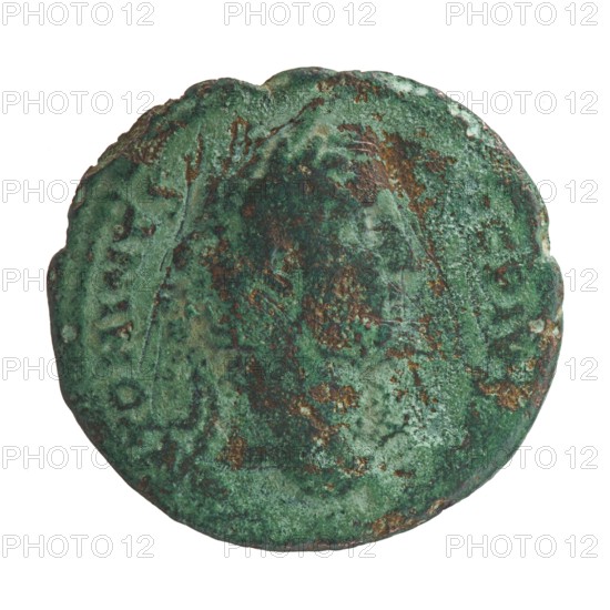 Antoninus Pius 86–161; Roman Emperor 138–161. Obverse: Head of Antoninus Pius in a laurel wreath facing right, legend ANTONINVS AVG PIVS PP. Reverse: Pax standing left, holding a twig in his right hand and a cornucopia in his left, inscriptions TR POT COS II and PAX with SC in fields. Personifications; horns of plenty. Coin struck in Rome, Roman Empire, 139. Bronze coin, diameter ~26.5–28.0 mm, weight 8.28 g, axis 180°., A round, weathered object with an uneven, slightly scalloped edge, showing a mottled surface of green and brown patina with areas of darker green and rusty brown; the texture appears rough and corroded with patches of lighter green and faint, worn raised shapes that suggest previous detailing.