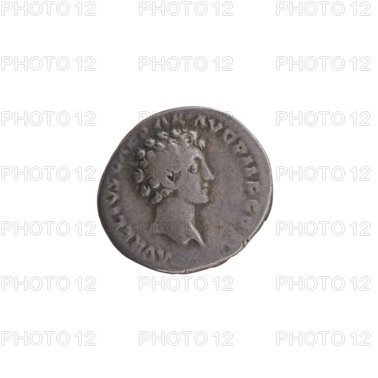 Denarius, Antoninus Pius 86–161; Roman emperor 138–161 issued by Marcus Aurelius 121–180; Roman emperor 161–180, caesar 139–161. Obverse: Head of Antoninus Pius with laurel wreath to the right, legend ANTONINVS AVG PI - VS PP TR P COS III. Reverse: Head of young Marcus Aurelius without a covering to the right, legend AVRELIVS CAESAR AVG PII F COS. Date: 140. Place of origin: Rome, Roman Empire. Coin; diameter 16.0–17.0 mm, weight 2.94 g, axis 210°., A round metallic coin with a worn surface showing a raised profile of a person facing right with short curly hair; the coin appears silver-gray with darker gray areas and slight brownish tarnish, and a thin raised rim around the edge.