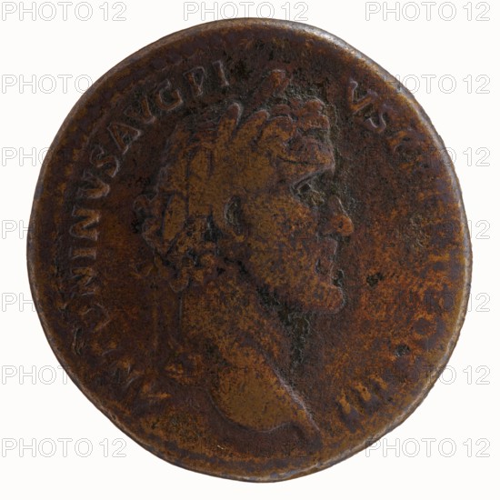Sestertius, Roman coin, c. 140–144. Obverse: Head of Antoninus Pius in a laurel wreath to the right, legend ANTONINVS AVG PI - VS PP TR P COS III. Reverse: Bust of young Marcus Aurelius in cloak paludamentum, without headgear, right, legend AVRELIVS CAESAR AVG PII F COS with control mark SC below portrait. Attributes: bronze, diameter 32.5–34.0 mm, weight 21.15 g, axis 0°. Subjects/iconography: Antoninus Pius and Marcus Aurelius caesar, portraits, paludamentums., A worn round metal object with a raised profile of a person's head in relief facing right, showing short curly hair and facial features; the surface has a mottled, aged patina with dominant brown and rusty orange tones, along with areas of darker brown and small spots of black; the edge is slightly irregular and darker than the center, and there are subtle raised decorative ridges near the rim.