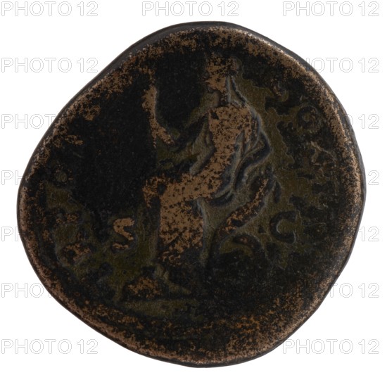 Sestertius of Antoninus Pius 86–161; Roman emperor 138–161. Bronze coin. Obverse: head of Antoninus Pius in a laurel wreath facing right, legend ANTONINVS AVG - PIVS PP IMP II. Reverse: Securitas seated left on a chair formed of crossed cornucopias, holding a scepter in her right hand and resting her left elbow on the chair, legend TR POT XX - COS IIII; control fields SC. Date: 156–157. Diameter 31.0–32.5 mm, weight 26.60 g, axis 0°. Place of origin: Rome, Roman Empire 27 BC–476. Iconography: personifications, scepters, cornucopias; issuer: Antoninus Pius., A round, worn coin with an uneven edge showing a relief of a seated figure facing left; the surface has mottled dark brown and black areas with lighter brown highlights where the metal is exposed, and traces of greenish patina in places.
