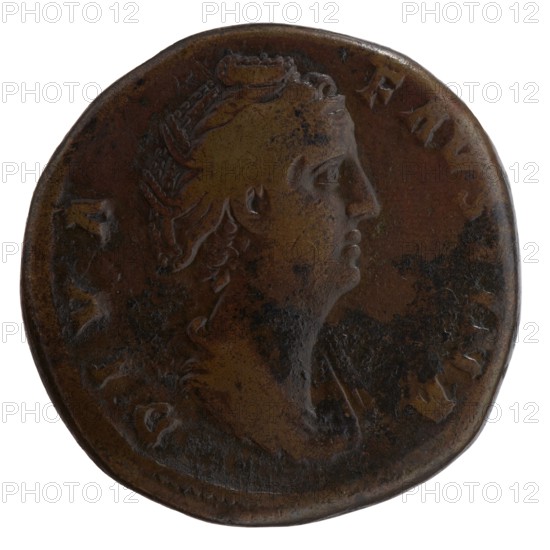 Sestertius, posthumous issue for Faustina the Elder 98–141; Roman empress 138–141; issuer: Antoninus Pius 86–161; Roman emperor 138–161. Obverse: Bust of Faustina I in drapery facing right, legend DIVA · FAVSTINA. Reverse: Juno veiled, standing left, right hand outstretched, holding a scepter in left; legend AETERNITAS in SC fields. After 141, Roman Empire; Rome. Coin: bronze, diameter ca. 29.5–31.5 mm, weight 23.35 g, axis 180°., A round, worn metallic object with a raised profile of a person's head facing right, showing facial features and detailed hair; the surface has areas of smooth wear and rougher mottled patches. The visible colors are brown, dark brown, and hints of black, with some slightly lighter brown highlights on raised areas. The edge is irregular and slightly darker than the central area.