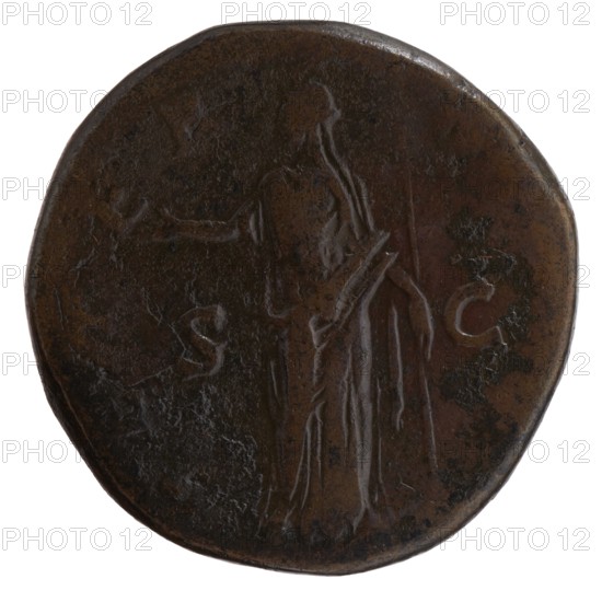 Sestertius, posthumous issue for Faustina the Elder 98–141; Roman empress 138–141, issued under Antoninus Pius 86–161; Roman emperor 138–161. Obverse: bust of Faustina I in drapery facing right, inscription DIVA · FAVSTINA. Reverse: Juno veiled standing left, right hand outstretched, holding a scepter in left, inscription AETER · NITAS. Inscriptions in SC fields. After 141, Roman Empire; minted in Rome. Bronze coin; diameters 29.5 mm and 31.5 mm, weight 23.35 g, axis 180°., A round, worn coin with a patina of dark brown and hints of lighter brown, showing a faint, raised depiction of a standing, robed figure facing sideways with an arm extended; the surface has areas of smooth wear and a few irregular darker spots, with the coin edge slightly uneven and a subtle sheen on some high points.