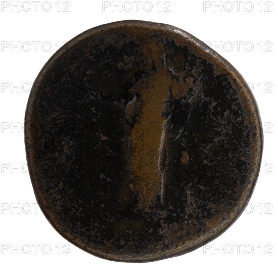 Sestertius, Faustina the Elder 98–141; Roman empress 138–141 posthumously, issued by Antoninus Pius 86–161; Roman emperor 138–161. Obverse: Bust of Faustina I in drapery facing right, legend DIVA · FAVSTINA around. Reverse: Vesta standing left, holding a statuette of Athena palladion in her outstretched right hand and a scepter in her left; legend AVGVSTA all around, SC in fields. After 141, Roman Empire; Rome. Coin: diameter 29.0 mm; weight 19.70 g; axis 345°., A round, worn object with an uneven surface and a slightly irregular rim, showing a mix of dark brown, black, and lighter brown tones; the center has a vertical, slightly raised area with a smoother lighter brown patch, while the surrounding areas show rough, pitted textures and mottled dark brown and black shading.