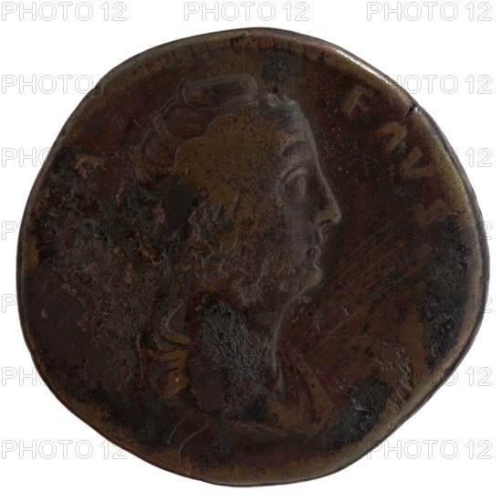 Sestertius, posthumous issue of Faustina the Elder 98–141; Roman empress 138–141, issued by Antoninus Pius 86–161; Roman emperor 138–161. Obverse: Bust of Faustina I draped, facing right; legend A·FAVSTINA. Reverse: Vesta standing left, holding a patera in her outstretched right hand above an altar and a long scepter in her left; legend CONSECRATIO in exergue. Date: after 141. Place of manufacture: Rome, Roman Empire. Medium: coin. Diameter: 31.5–33.0 mm. Weight: 22.65 g. Axis: 180°., A round, worn coin with a raised profile of a person facing right; the surface shows uneven texture and areas of corrosion. The coin displays a patina of dark brown and bronze tones with patches of lighter brown and hints of black and greenish discoloration. The raised portrait and surrounding details are visible in varying relief, with some smoother, shinier spots and other rough, pitted areas. The coin edge is irregular and slightly indented in places.