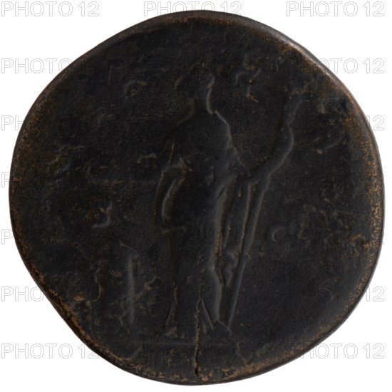 Sestertius, Faustina the Elder 98–141; Roman empress 138–141 posthumous issue, issuer: Antoninus Pius 86–161; Roman emperor 138–161. Draped bust of Faustina I facing right, legend DIVA FAVSTINA all around; reverse: Vesta standing left, holding a patera above an altar in her outstretched right hand and a long scepter in her left. Legend C ONS E C R ATIO in the fields. After 141, Rome; Roman Empire. Coin sestertius, dia. 32.5–33.0 mm, weight 29.55 g, axis 180°., A round dark brown and black object with a worn surface showing the faint outline of a standing human figure holding a long staff, with subtle lighter brown edge wear and a few small areas of lighter brown patina across the surface.