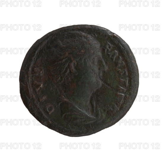 Dupondius/as, Faustina the Elder 98–141; Roman empress 138–141 posthumously, Antoninus Pius 86–161; Roman emperor 138–161 issuer. Obverse: Bust of Faustina I in drapery facing right, inscription DIVA • FAVSTINA. Reverse: Vesta standing left, holding a statuette of Athena palladium in her outstretched right hand and a long torch in her left, inscription A • VG • V • STA around, in SC fields. After 141, Roman Empire; Rome mint. Coin: dupondius/as; diameter obv. 26.5 mm, rev. 28.5 mm; weight 12.30 g; axis 0°., A round, worn coin with a raised profile of a person's head in the center, showing details of hair and facial outline; the surface appears textured and uneven with areas of corrosion. The coin displays a mix of dark brown, green, and darker green-black tones across its surface, with lighter brown highlights on raised areas. The edge of the coin is slightly irregular and the background behind the coin is white.