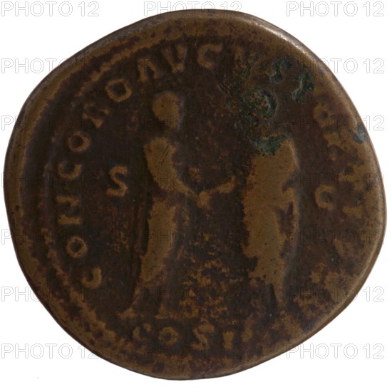 sestertius forgery, Marcus Aurelius 121–180; Roman emperor 161–180 issuer: Marcus Aurelius, Lucius Verus Roman emperor; 130–169 - iconography, Marcus Aurelius - iconography, scrolls, handshake. Obverse: Head of Marcus Aurelius uncovered, with drapery on the left shoulder, right; legend IMP CAES M AVREL - ANTONINVS AVG PM. Reverse: Marcus Aurelius and Lucius Verus stand opposite each other and shake hands; Marcus Aurelius holds a scroll; legend CONCORD AVGVSTOR TR P XVI; in the episode COS III, in fields SC; dated 161–162 for the original, Roman Empire 27 BC–476, Rome. Counterfeit coin; weight 24.65 g; diameter 33.5–34.0 mm; axis 0°., A round, worn coin with a dark brown patina and areas of lighter brown and greenish corrosion, showing the faint silhouettes of two standing figures facing each other with their hands meeting between them; the coin edge is rounded and slightly irregular, and the surface has mottled brown tones with patches of darker brown and hints of green.
