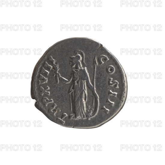 Denarius, Marcus Aurelius 121–180; Roman emperor 161–180. Obverse: Head of Marcus Aurelius with laurel wreath facing right, legend M ANTONINVS - AVG IMP II. Reverse: Minerva standing left, holding a branch in her right hand, left hand supporting a round shield against which a spear is leaning, legend TR P XVIII - COS III. Date: 163–164. Place of origin: Rome. Type: coin denarius. Weight: 3.1 g. Diameter: 17–18 mm. Axis: 180°., A metal coin with a worn surface appears against a white background; the coin is primarily gray with darker and lighter silver tones and shows the raised outline of a standing human figure in draped clothing holding an object in one hand and a long staff or spear in the other, with a rounded rim and irregular edge and visible wear marks and scratches.