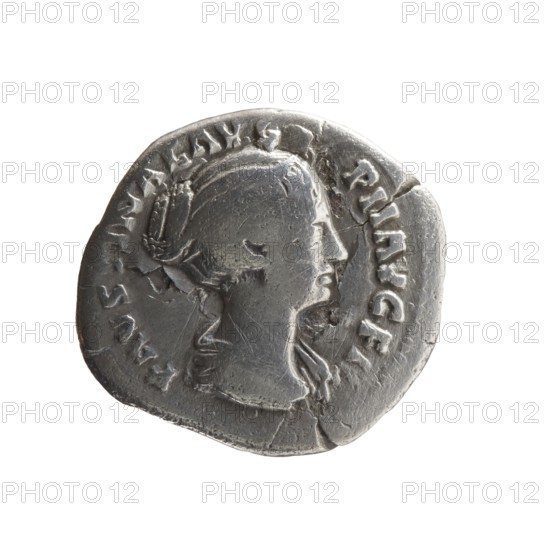 Denarius subaerate of Faustina the Younger ca. 130–176; Roman empress 161–176; Augusta 147–161. Obverse: Draped bust of Faustina II facing right, legend FAVSTINAE AVG - PII AVG FIL. Reverse: Venus standing left, holding an apple in her outstretched right hand and a rudder in her left hand, a dolphin wrapped around the rudder, legend V E - NVS. Iconography: Roman deities, apples, dolphins, rudders, Venus; Faustina the Younger iconography. Roman Empire, Rome; coin. Diameter 17.0–18.0 mm, weight 2.65 g, axis 180°., A worn circular metallic object with an irregular edge, shown against a white background, featuring a raised profile of a person in side view with visible facial contours and hair styled back; the surface has scratches, dents, and areas of tarnish with darker and lighter silver-gray tones; a ring of raised decorative marks surrounds the central portrait, and there are a few small cracks and chips along the rim.