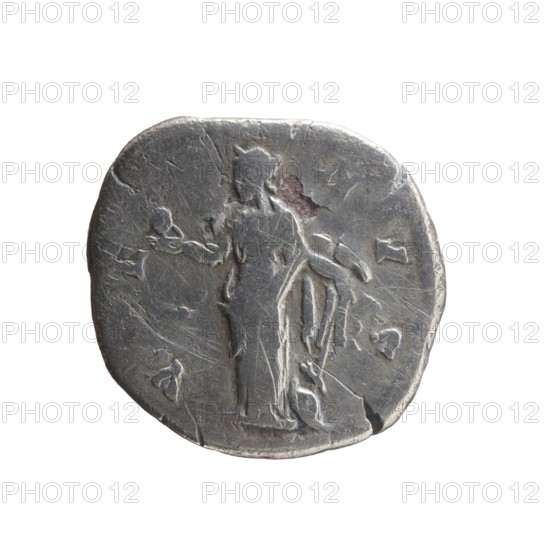 Denarius subaerate, Faustina the Younger ca. 130–176; Roman empress 161–176; Augusta 147–161. Obverse: draped bust of Faustina II facing right, legend FAVSTINAE AVG - PII AVG FIL. Reverse: Venus standing left, holding an apple in her outstretched right hand and a rudder in her left, a dolphin wrapped around the rudder, legend V E - NVS. Roman Empire, Rome, ca. 147–161. Coin; diameter 17.0–18.0 mm, weight 2.65 g, axis 180°., A worn round metallic coin with a dull silver-gray surface and lighter highlights, showing a raised central figure standing and facing slightly to the left, with a draped garment and an outstretched arm holding a small round object; the coin surface has scratches, small dents, and areas of darker tarnish and faint brownish discoloration, and a few shallow raised symbols around the figure; the coin edge is irregular with small chips and a slightly darker rim.