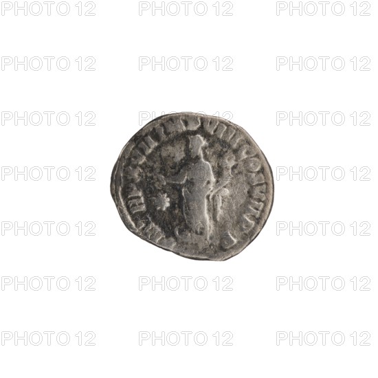 Denarius of Commodus reigned 177–192. Obverse: Head of Commodus in a laurel wreath facing right, inscription L AEL AVRELCOMM AVG P FEL. Reverse: Fortuna Felix standing left, holding a cornucopia in left hand and a caduceus in right, resting her leg on a ship, a star in the left field; inscription P M TRP XVII IMP VIII COS VII PP. Date: 192. Roman Empire; Rome mint. Materials/format: coin denarius, diameter ~15–17 mm, weight 2.40 g, axis 180°. Iconography: Commodus; Roman deities; Fortuna; caduceus; ships; stars; cornucopias., A roughly circular metallic object with a worn, textured surface appears against a white background; the object shows a raised central figure in low relief surrounded by an irregular rim with embossed markings, and the visible colors are shades of gray, dark gray, and some darker tarnished areas.