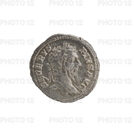 Denarius; obverse: head of Septimius Severus in a laurel wreath facing right, legend SEVERVS PIVS AVG, pearl rim. Reverse: naked Genius standing frontally, head turned left, holding a patera over a lit altar in his right hand and ears of corn in his left, legend PM TR P XIII COS III PP, pearl rim. Maker: mint of Rome; date: reign of Septimius Severus 146–211, 206 CE. Coin, Roman Empire; diameter ~18.5–19.5 mm, weight 2.28 g., A round metallic object with a worn, textured surface showing a raised profile of a bearded head in relief, surrounded by a raised border and decorative raised markings along the edge; the object appears in shades of silver and gray against a white background.