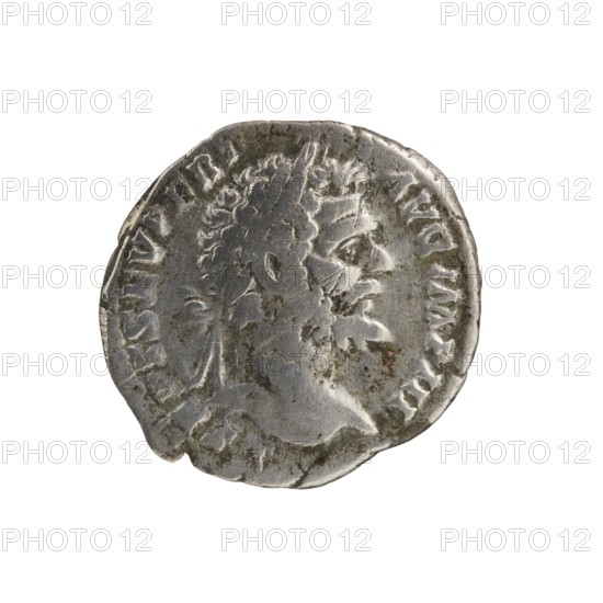 Denarius of Septimius Severus 146–211; Roman emperor 193–211, issuer attributed to Septimius Severus. Obverse: Head of Septimius Severus with laurel wreath facing right, inscription L SEPT SEV PERT - AVG IMP III. Reverse: Pax personified seated left, holding a twig in his outstretched right hand and a cornucopia horns of plenty in his left, inscription PACI AV - GVSTI. Dated 194. Roman Empire, Rome. Coin: diameter 18.0–19.0 mm, weight 2.50 g, axis 0°., A worn round metallic object with a raised profile of a bearded head in relief, showing textured hair and facial features in side view, with visible surface scratches, patina, and areas of darker tarnish; the object appears primarily silver-gray with spots of darker gray and brownish discoloration along the edges and on the face, set against a plain white background.