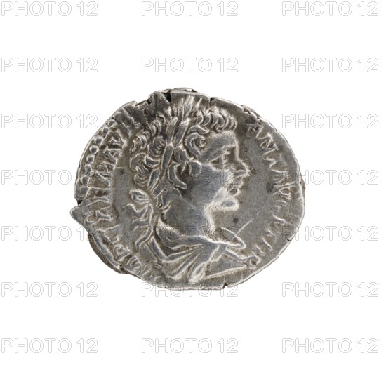 denarius, Septimius Severus 146–211; Roman emperor 193–211 issuer, Caracalla 188–217; Roman emperor 198–217 caesar, Spes personification, Spes striding iconographic. Obverse: M AVR ANTONINVS CAES, bust in cloak and armor facing right. Reverse: SPEI PERPETVAE, Spes striding left, holding a flower, 196. Roman Empire 27 BC–476, Rome. Coin; diameter 17.5–18.0 mm; weight 2.97 g., A round, metallic coin with a patinated silver-gray surface showing wear and small nicks along the edge, featuring a raised profile of a person facing right with wavy hair and a laurel-like headband, and textured clothing folds visible on the neck and shoulder area; the background is white and the visible colors are silver-gray and subtle darker gray tones.