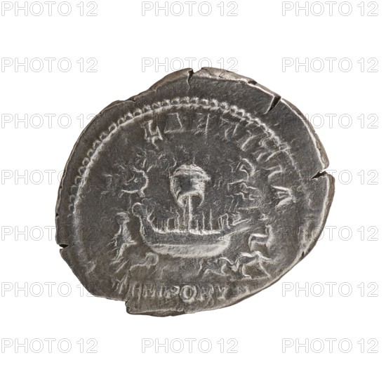 Denarius of Caracalla 188–217; Roman emperor 198–217. Obverse: ANTONINVS PIVS AVG — head of Caracalla with laurel wreath facing right. Reverse: LAETITIA TEMPORVM — ship, animals running around, four quadrigae in the background. Roman Empire, Rome; dated 206–210. Coin; diameter 18.5–22.0 mm; weight 3.14 g., A round metallic object with a worn, uneven edge showing small chips and cracks, displaying a relief image of a boat with a central vertical mast and a curved hull, surrounded by a decorative raised border and faint markings around the rim; the surface shows variations in tone and texture with areas of lighter and darker grey and metallic silver.
