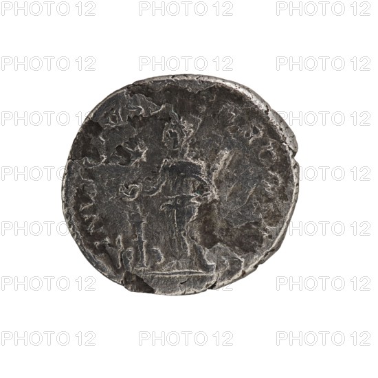 Denarius, Elagabalus 204–222; Roman emperor 218–222. Obv.: IMP ANTONINVS PIVS AVG — Bust of Elagabalus with a laurel wreath and paludamentum facing right; pearl border. Rev.: INVICTVS SACERDOS AVG — Elagabalus wearing a laurel wreath and long robe, standing left, holding a patera above an altar in his right hand and a scroll in his left hand; star at the top in the left field; pearl border. Rome, 218–222. Roman Empire. Coin; diameter ~27.5–28.5 mm; weight 2.97 g., A worn round metal object with an uneven edge sits against a white background; the surface shows textured irregularities and shallow relief suggesting faint shapes and contours, with visible areas of dark gray and lighter silvery gray tones across its face, and small patches of slightly darker shadowed gray near the rim.