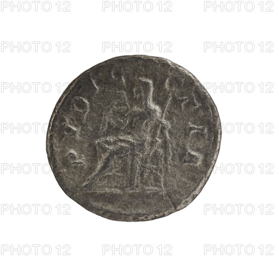 Denarius of Julia Maesa ca. 160–224; Augusta 218–224, Roman Empire. Obverse: Draped bust of Julia Maesa facing right, pearl rim, inscription IVLIA MAESA AVG. Reverse: Inscription PVDICITIA; veiled Pudicitia seated on a throne facing left, raising the hem of her veil with her right hand and holding a scepter in her left, pearl rim. Date: 218–222. Coin diameter c. 17.5–18.5 mm; weight 2.61 g., A round, worn coin with a textured surface is shown against a plain white background; the coin appears dark gray with lighter gray highlights on raised areas, and it features a central, shallowly embossed scene of a seated figure beside a standing figure, both rendered in low relief and surrounded by traces of decorative elements along the rim.