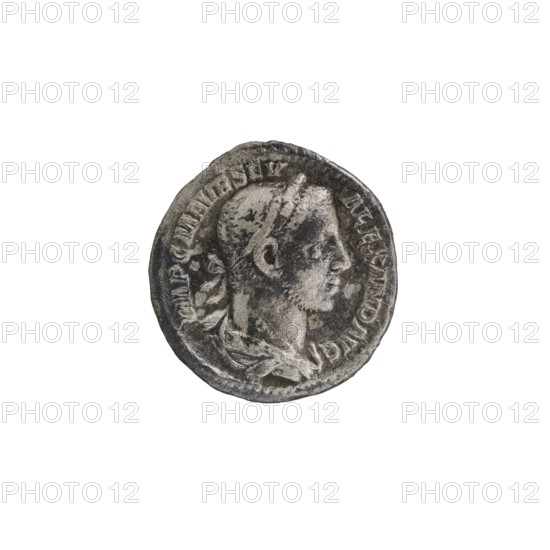 Denarius; obverse: IMPCMAVRSEV ALEXANDERAVG — Bust of Alexander Severus with laurel wreath and paludamentum facing right, pearl rim. Reverse: PMTRPV COSIIPP — Naked Mars striding right, holding a spear in his right hand, tropaion resting on his left shoulder, pearl rim. Dated 226; Roman Empire 27 BC–476; mint: Rome. Coin; diameter 18.0–19.0 mm; weight 3.10 g., A worn round metallic object with a raised profile of a person in relief facing to the right, showing contours of the head, ear, neck, and part of the upper chest, with a laurel-like element at the neckline and textured surface details; the object shows uneven darker and lighter gray tones with areas of darker patina and lighter highlights, and a rough irregular rim against a white background.