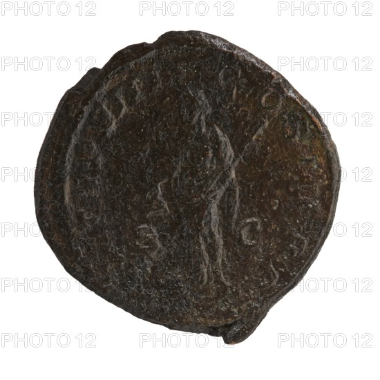 Sestertius of Alexander Severus Roman emperor; 222–235 — obverse/inscription and iconography include personifications, Libertas personification; dated 229, struck in Rome; Roman Empire 27 BC–476; coin, diameter ~32–33 mm, weight 25.08 g., A circular, worn object with an uneven edge showing a dark brown, almost black patina with lighter brown and faint greenish areas, featuring a faint raised profile of a person in the center and subtle raised marks around the perimeter.