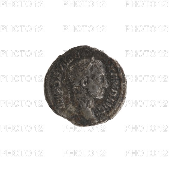 denarius, Alexander Severus Roman emperor; 222–235 — iconography, personifications, Virtus personification, 228–231, Roman Empire 27 BC–476, Rome; coin; diameter 19.0–20.0 mm; weight 2.55 g, A round, worn coin with a raised profile of a person's head facing right in the center, showing short hair and facial features in low relief; the coin surface is rough and pitted with irregular edges and visible signs of wear; the overall color palette includes dark gray, silver, and patches of brownish tarnish; faint raised ridges form a circular border around the portrait and subtle textured areas radiate outward from the center.