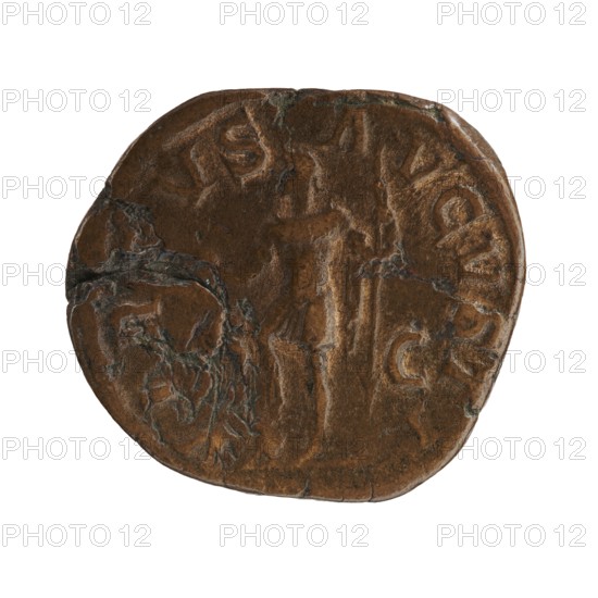 sestertius; personifications; Virtus personification; Alexander Severus Roman emperor; 222–235 — iconography, 228–231; Roman Empire 27 BC–476 place of creation: Rome; coin; coin: diameter 27.5 mm–30.0 mm; weight 15.45 g, A worn round object with an irregular edge appears against a white background; its surface is mostly brown with darker brown and greenish-gray areas where the material shows rough, cracked textures; faint raised shapes and shallow depressions form a central vertical impression and curved forms near the perimeter, and the surface shows patches of smoother brown and mottled darker regions.