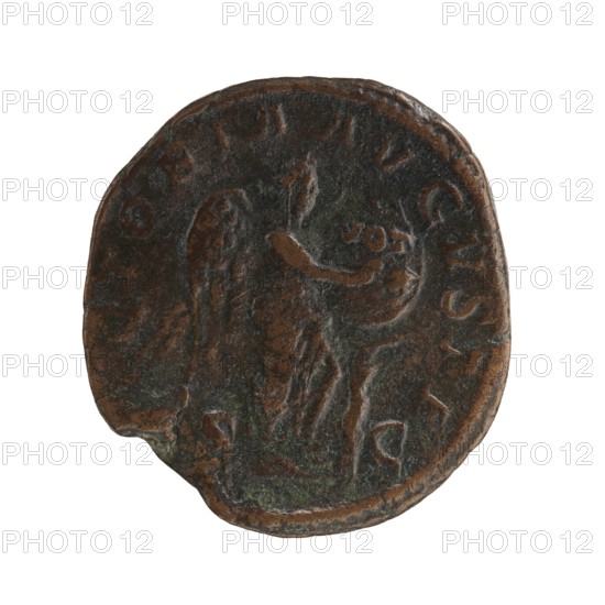 sestertius; Roman deities; Alexander Severus Roman emperor, 222–235; iconography: Victoria mythology; dated 228–231; Roman Empire 27 BC–476, Rome; coin; diameter 27.5–29.5 mm; weight 17.32 g, A round, worn coin with a dark brown and greenish patina showing a raised figure of a winged person holding a long object and an orb, with a few raised decorative elements and an uneven edge.