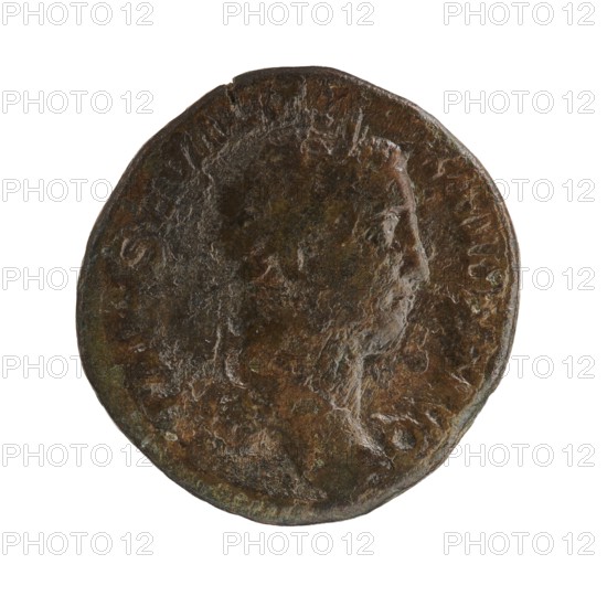 Sestertius coin depicting Roman deities and Victoria; reverse shows Victoria mythology. Obverse: Alexander Severus Roman emperor, reign 222–235 — iconography dated 228–231. Origin: Rome, Roman Empire 27 BC–476. Object type: coin sestertius. Dimensions: diameters 28.5–30.0 mm; weight 18.25 g., A worn round coin with an uneven edge showing a raised profile of a human face in right-facing view; the surface is textured with corrosion and pitting. The coin displays a mix of dark brown, greenish patina, and lighter brown highlights where the metal is more exposed. The background is plain and white.