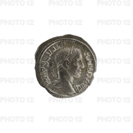 Denarius; obverse: Jupiter Roman deity; issuer: Alexander Severus Roman emperor, 222–235; iconography dated 228–231, Rome mint; Roman Empire 27 BC–476; coin; diameter 19.0–20.0 mm; weight 2.62 g., A round metallic coin with a worn, uneven edge showing the profile of a man's head facing right, featuring short textured hair, a laurel or headband, a trimmed beard, and a visible ear; the coin surface shows raised relief details and a beaded inner border, with areas of darker and lighter metallic tones in silver and gray.