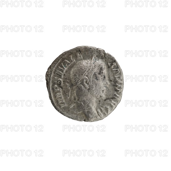 Denarius depicting Roman deities and Jupiter; issued under Emperor Alexander Severus reigned 222–235 CE, iconography dated 228–231 CE. Roman Empire; mint: Rome. Coin; diameters 17.5 mm and 18.0 mm; weight 2.53 g., A worn round coin with a raised profile of a person facing right, showing facial features and short hair, with a textured surface and irregular edges; the coin appears metallic with shades of gray and silver and slight darker gray areas, set against a plain white background.