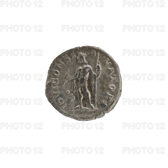 Denarius depicting Roman deities and Jupiter; Alexander Severus Roman emperor, 222–235; iconography dated 228–231; place of origin: Rome, Roman Empire 27 BC–476; coin. Dimensions: diameter 17.5–18.0 mm; weight 2.53 g., A circular metallic object with a worn, textured surface showing a standing human figure in relief, the figure holding a long staff and draped in cloth; the metal appears mainly grey with small areas of darker grey and faint bluish-green spots, and the edges of the object are irregular and slightly chipped.