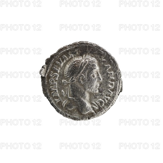 Denarius depicting Roman deities and Jupiter; obverse: Alexander Severus Roman emperor, 222–235 — iconography; date: 228–231 CE; place of origin: Rome, Roman Empire 27 BC–476; medium: coin; dimensions: diameter 19.0–20.5 mm; weight 2.62 g., A circular metallic object with a raised profile of a person's head in relief, showing facial features and short textured hair, surrounded by a raised rim and decorative border; the surface appears worn and uneven with a few small chips along the edge. The visible colors are silver, gray, and darker gray tones.