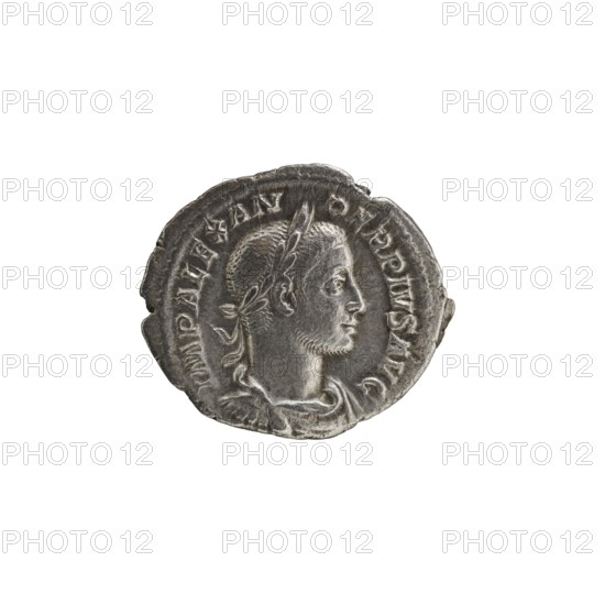 denarius; Roman deities; Sol; Alexander Severus Roman emperor, r. 222–235 — iconography; 231; Roman Empire 27 BC–476 place of origin: Rome; coin; diameter 18.0 mm; diameter 20.5 mm; weight 2.76 g, A round metallic coin with a worn, textured surface showing a right-facing profile of a man with short hair and a laurel-like headband; the coin appears primarily silver-gray with darker gray areas in recessed details and lighter gray highlights on raised surfaces, and a few brownish-gray spots along the edge.