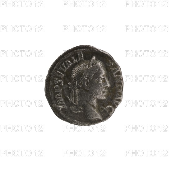 Denarius of Alexander Severus reigned 222–235 CE. Obverse: portrait of Alexander Severus Roman emperor, 222–235. Reverse: Victoria Roman deity. Roman imperial coin struck in Rome, Roman Empire 27 BCE–476 CE. Coin: diameter 18.5–19.0 mm, weight 2.30 g. Icons/subjects: Alexander Severus; Victoria. Dates referenced: 228–231., A round metallic object with a worn surface and dark gray to silver tones showing a raised profile of a person facing right, with short textured hair and a headband or laurel-like band; the rim is uneven and there are rough indented marks and subtle highlights on the raised features against darker recessed areas.