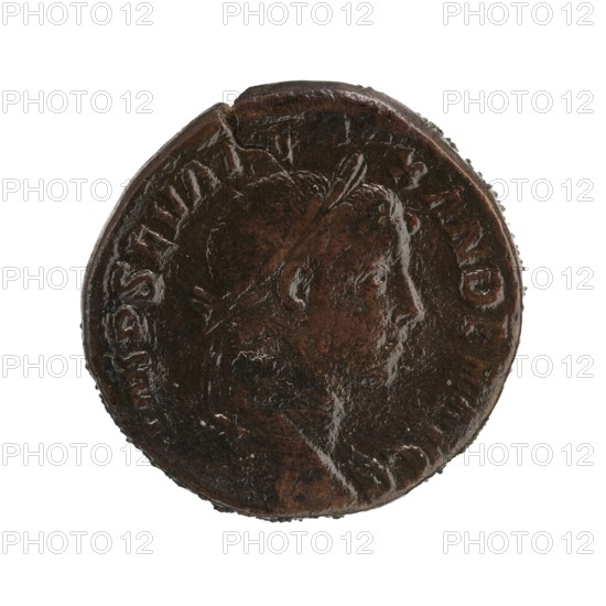 sestertius; personifications; Alexander Severus Roman emperor; 222–235 — iconography: Annona personification; date: 228–231; Roman Empire 27 BC–476 place of origin: Rome; object type: coin sestertius; dimensions: diameter 28.0–28.5 mm; weight 18.01 g, A circular metallic object with a dark brown and black patina, showing the raised profile of a person's head in relief facing right; the head has short hair and a laurel-like band, and the surface shows worn and shiny areas with uneven texture and small chips along the rim.