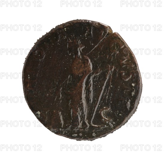 Sestertius; personifications; Alexander Severus Roman emperor, 222–235; iconography: Annona personification; date: 228–231; place of origin: Roman Empire 27 BC–476, Rome; object type: coin; material: coin; diameter: 28.0–28.5 mm; weight: 18.01 g, A round, dark brown object with a worn, uneven surface and a few lighter brown and black areas, showing a raised outline of a standing human figure draped in flowing garments; the edges are irregular with small chips and a few pale greenish-white spots, set against a white background.
