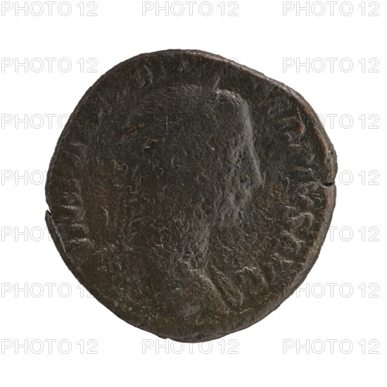 Sestertius; personifications; Alexander Severus Roman emperor, 222–235 — iconography: Annona personification; 231; Roman Empire 27 BC–476, Rome; coin; diameter 29.0 mm and 30.5 mm; weight 19.65 g., A circular, worn object with a rough, pitted surface and irregular edges, shown against a white background; the object appears mostly dark brown with areas of darker almost black patina and a few subtle reddish-brown highlights, and it has faint raised contours suggesting a profile or shape on its face.