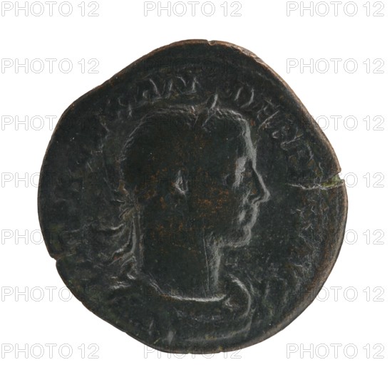 Sestertius of Severus Alexander reigned 222–235 CE, Roman imperial coin depicting Jupiter; obverse/issuer: Severus Alexander Roman emperor, 222–235 — iconography dated circa 231–235 CE, struck in Rome. Roman Empire 27 BCE–476 CE. Coin; diameter ~30–31 mm; weight 16.93 g., A round, dark coin with a worn profile of a head in relief facing right, showing the forehead, nose, lips, chin, and neck; the coin surface is mottled with patches of brownish rust and darker green-black patina, and there are a few lighter highlights where the relief is smoother; the coin edge is irregular and slightly chipped in places.