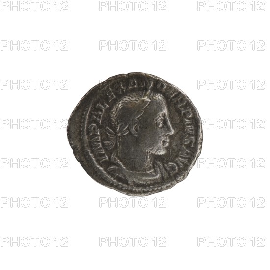Denarius of Alexander Severus reigned 222–235. Obverse: portrait of Alexander Severus Roman emperor, 222–235. Reverse: Mars Roman deity. Iconography dated 231–235. Roman Empire; Rome mint. Coin; diameter 17.5–20.0 mm; weight 2.66 g., A round metallic object with a worn, textured surface showing a raised profile of a person facing right, with short hair and a laurel-like element at the back of the head; the object is primarily dark gray with areas of lighter gray highlights and subtle brownish tones, and it sits against a plain white background.