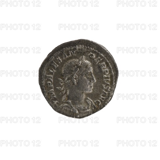 Denarius of Alexander Severus Roman emperor, 222–235 CE. Obverse: laureate bust of Alexander Severus. Reverse: Sol Roman deity standing. Roman Empire, Rome, 232 CE. Coin; diameter 19.0–20.0 mm; weight 3.34 g., A round metal coin with a worn, uneven edge showing a raised profile of a person facing right with detailed hair and a decorative headband, surrounded by a raised border and worn markings; the coin surface shows varied texture and patina in shades of grey, dark grey, and a few brownish hints.