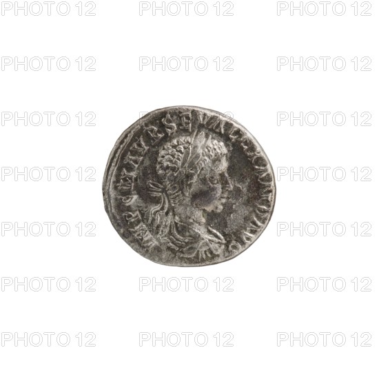 Denarius of Alexander Severus Roman emperor 222–235. Obverse: portrait of Alexander Severus; reverse: Concordia personification. Roman deities; iconography. Minted at Antioch on the Orontes, Roman Empire 222–235. Coin; diameter c.17.5–18.0 mm; weight 3.26 g., A round metallic coin with a worn, textured surface showing a raised profile of a person facing right; the profile has short, curly hair and a draped garment visible at the shoulder. The coin displays a raised border and a ring of raised, irregular shapes around the profile. Visible colors include shades of silver, gray, and dark gray with areas of darker patina.
