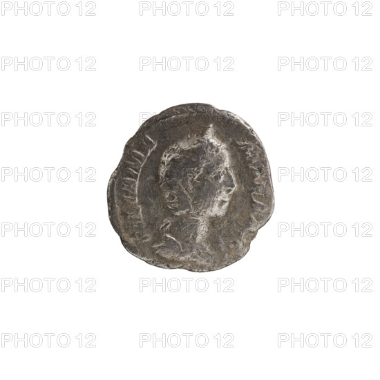 Denarius of Julia Mamaea ca. 180–235; Augusta 222–235 issued under Alexander Severus 208–235; Roman emperor 222–235. Obverse: portrait/iconography of Julia Mamaea 180–235. Reverse: personification Fecunditas. Date: 225–235. Roman Empire; Rome. Coin; diameter 17.5–18.5 mm; weight 2.21 g., A round metallic object with an irregular edge showing a raised profile of a person in relief; the surface appears worn with textured areas and shallow indentations, and the visible colors are gray, dark gray, and hints of brown.