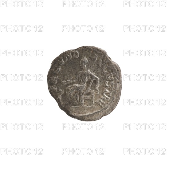 Denarius; obverse: Julia Mamaea ca. 180–235; Augusta 222–235, issuer Alexander Severus 208–235; Roman emperor 222–235; reverse: personification Fecunditas. Iconography of Julia Mamaea, dated 225–235. Roman Empire, Rome. Coin; diameter 17.5–18.5 mm; weight 2.21 g., A worn circular metal object with an uneven edge showing a raised, weathered design of a seated human figure facing left, the figure appearing to rest one arm on a surface and the other extended slightly, with surrounding shallow raised markings near the rim; the object shows a textured, pitted surface and a patina in shades of gray and dark gray with hints of brown.