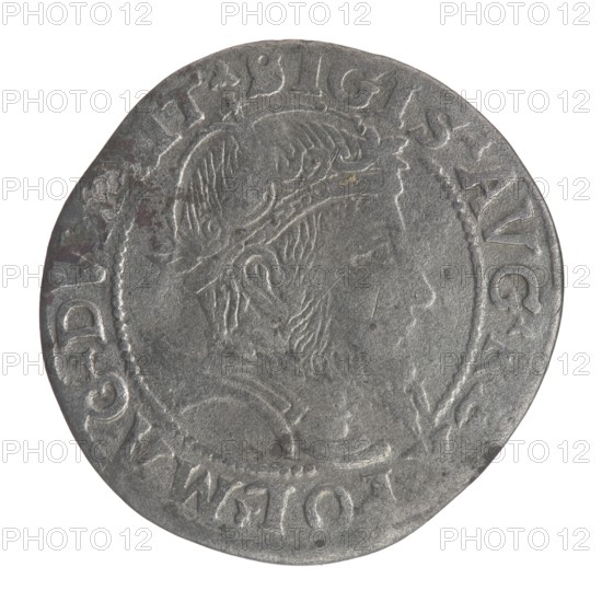 Lithuanian grosz on a Lithuanian foot, Sigismund II Augustus King of Poland; 1544–1572 author; coats of arms; Jagiellons dynasty; royal bust iconography; Polish coins; Sigismund II Augustus King of Poland; 1520–1572 - iconography; male busts; Pogon coat of arms; Lithuania; Columns of Gediminas coat of arms of Lithuania. Obverse: Crowned male bust in armour with profile turned to the right; in the rim an inscription divided at the top by a crown cross: .SIGIS.AVG.REX.POL.MAG.DV. .IT. Reverse: Lithuanian Pursuit facing left; below the date 1556 and the Column coat of arms dividing the inscription in the rim: MONE.. .AGNI - DVCAT9.LITVA. Date: 1556. Places: Poland; Grand Duchy of Lithuania. Object: coin., A circular metallic coin with a worn silver-gray surface showing a raised profile of a bearded man wearing a crown or ornate headpiece facing right; the coin has a textured rim and a decorative beaded inner border surrounding the portrait, with uneven edges and slight discoloration in a ...